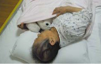 Dementia patient sleeping with PARO