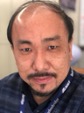 ○○主任研究員の写真